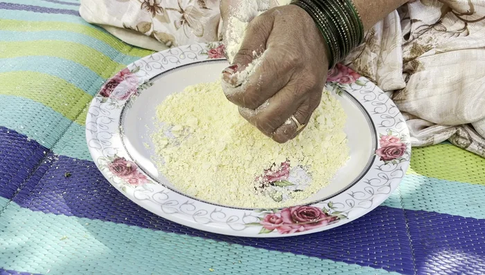 Add milk and rub it thoroughly into the dough until it's well combined.