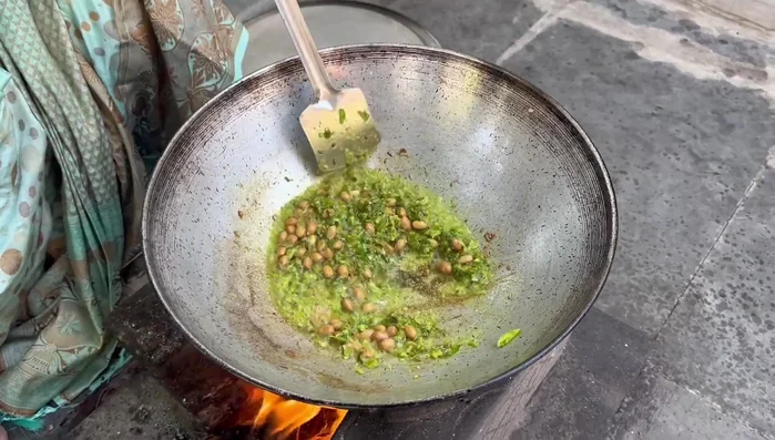Add peanuts and fry until golden brown.