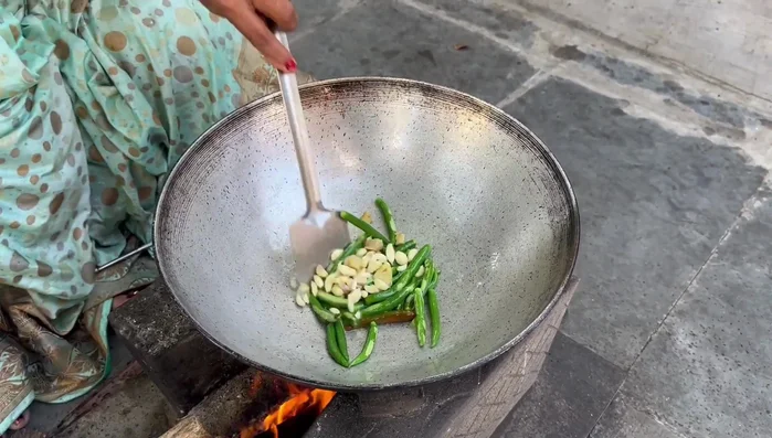Add ginger and garlic to the pan and roast with the chilies.