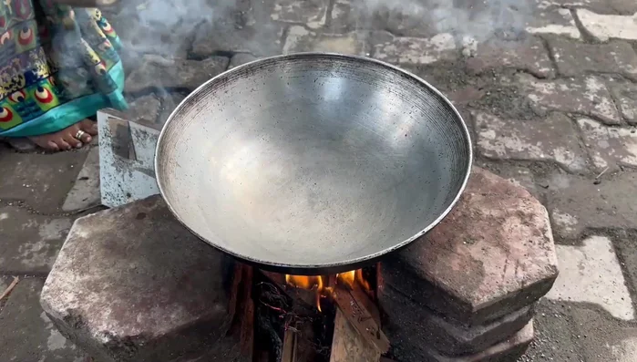 Make small patties (vadis) from the prepared batter and gently place them in the hot oil.