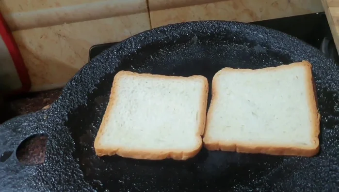 Toast bread slices on a dosa stone or griddle with ghee or butter until golden brown.