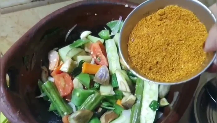 Add sambar powder and mix well with the oil to release its flavor.