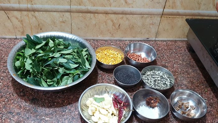 Start by preparing the curry leaves.