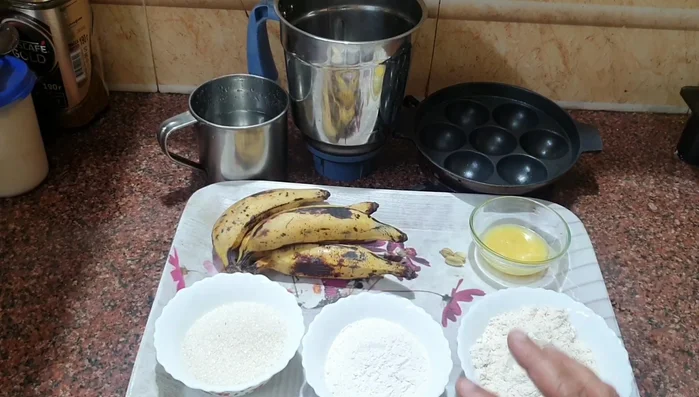 Add maida flour, rice flour, sugar, cardamom, baking soda, and salt to the ground nendra fruits.