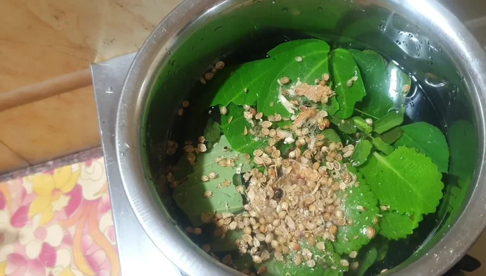 Boil the mixture until the herbs are well cooked and their juice is released into the water.