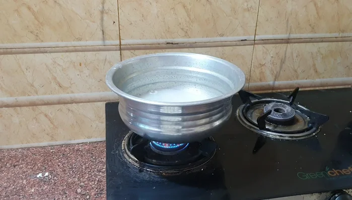 Boil water in a pot. Gently drop the pure kozhukatta dumplings into the boiling water and cook until they float to the surface. Do not stir.