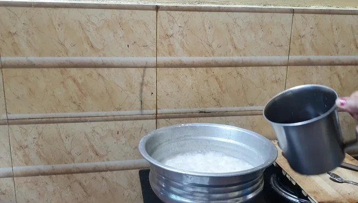 Serve the pure kozhukatta immediately or later. For the milk kozhukatta, add the cooked milk mixture to the boiled dumplings. Stir gently and let it sit for 2 minutes.