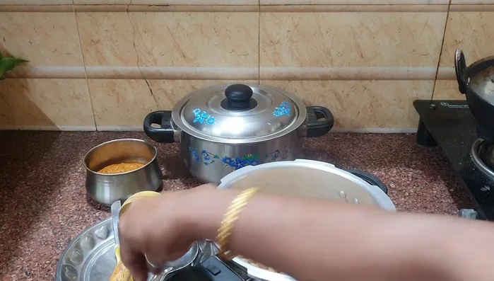 Release pressure from the cooker and add the cooked chickpeas (132.319).