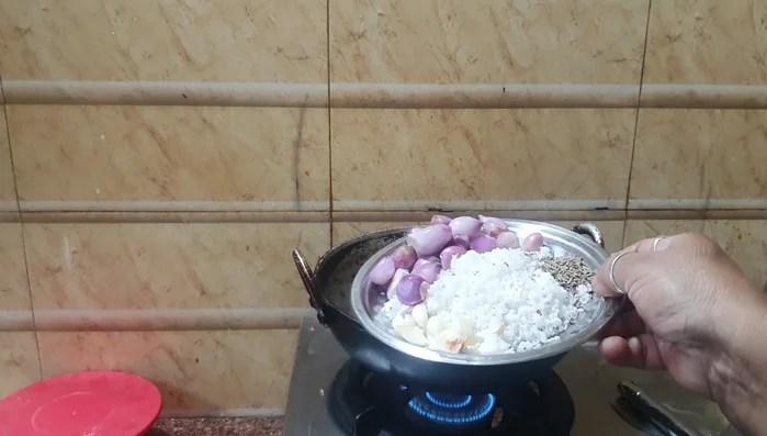 Heat coconut oil in a cooking pot.
