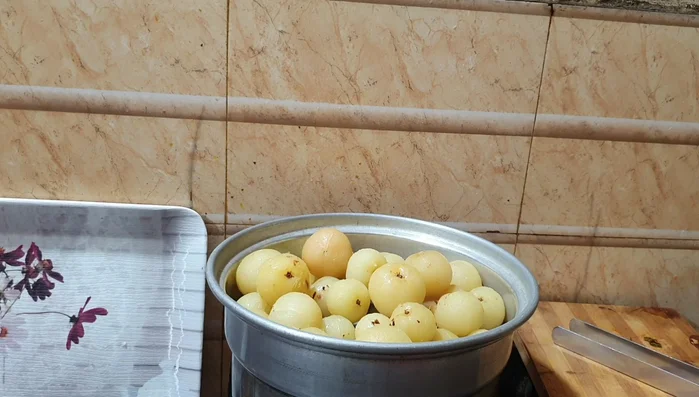 Mix gooseberries with salt and let them sit for at least a few hours or overnight to release water and reduce bitterness. This is a crucial step for good pickle texture and taste.