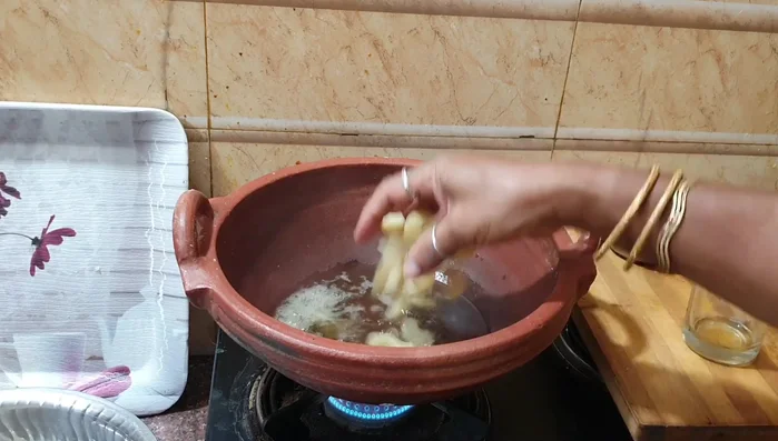 Add the drained gooseberries to the pan. Mix well with the spice mixture and turmeric powder. Cook until the gooseberries are slightly soft but not mushy. This ensures the right balance of texture.