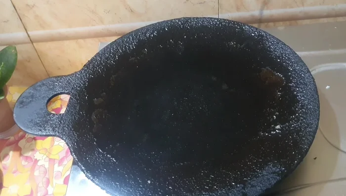 Heat a dosa pan/tava. Pour a ladleful of batter onto the hot surface and spread it thinly into a circle.