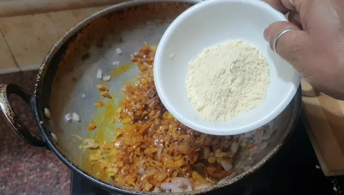 Lightly fry groundnut flour separately and add it to the masala.