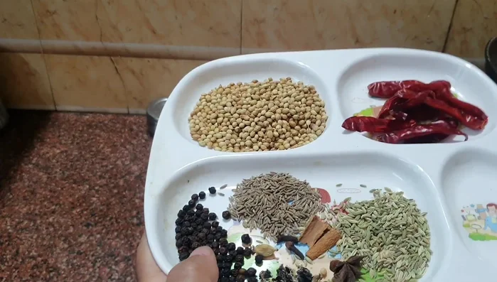 Add spices (amounts not specified in transcript).
