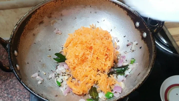 Add grated carrots. Grated carrots cook faster than chopped.