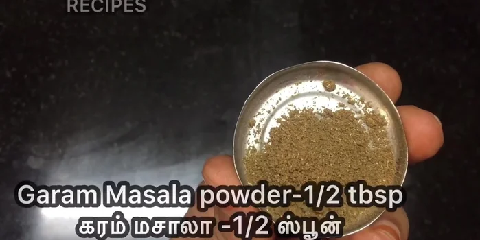 Add spices and garam masala. (Inference based on common cooking practices)