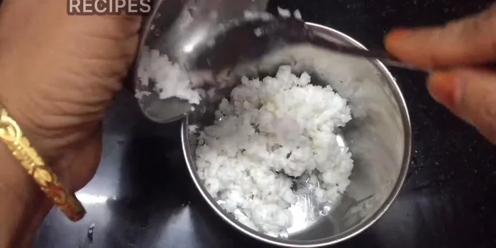 Pour the egg mixture into the pan with the sauteed vegetables and spices. (Inference based on common cooking practices)