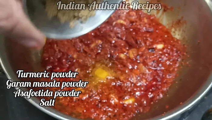 Add turmeric powder, garam masala, coriander powder, salt, and sugar. Fry until oil separates.