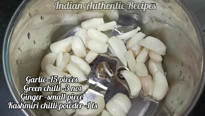 Grind garlic, ginger, and green chilies into a paste. Add optional Kashmiri chili powder or regular chili powder.
