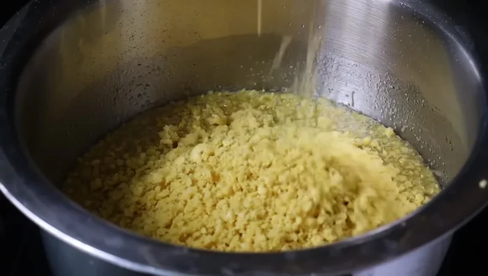 Shape the mixture into small laddu balls.