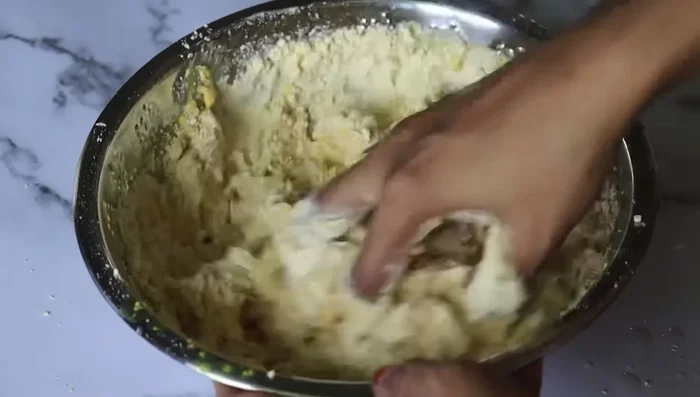 Prepare the boondhi batter (mix gram flour and water).