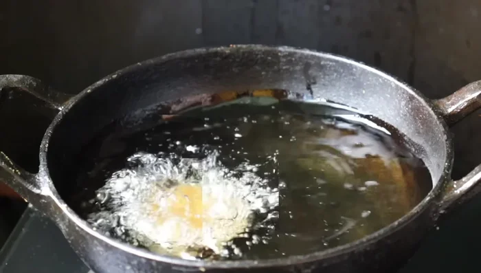 Pour the batter into the heated pan.