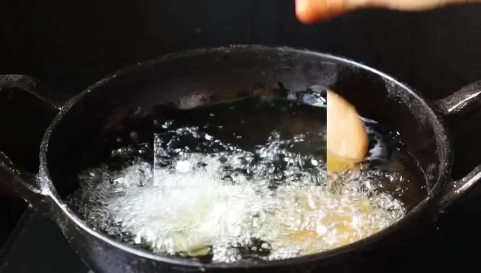 Continue to stir until the mixture thickens into a dough-like consistency.