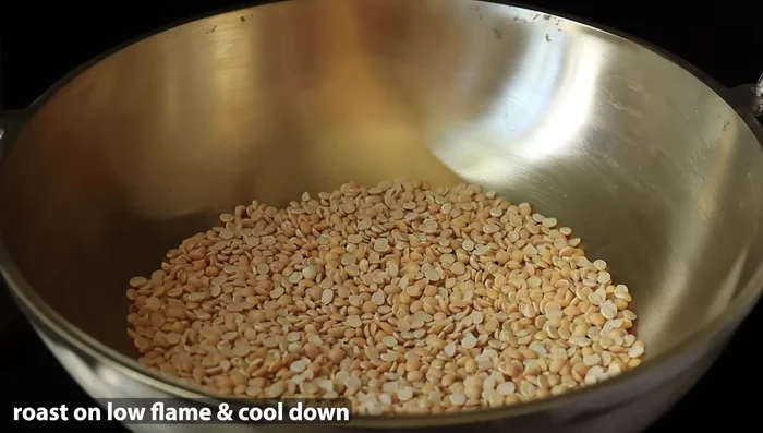 Dry roast the dals (toor dal, chana dal, and urad dal) until they turn golden brown.