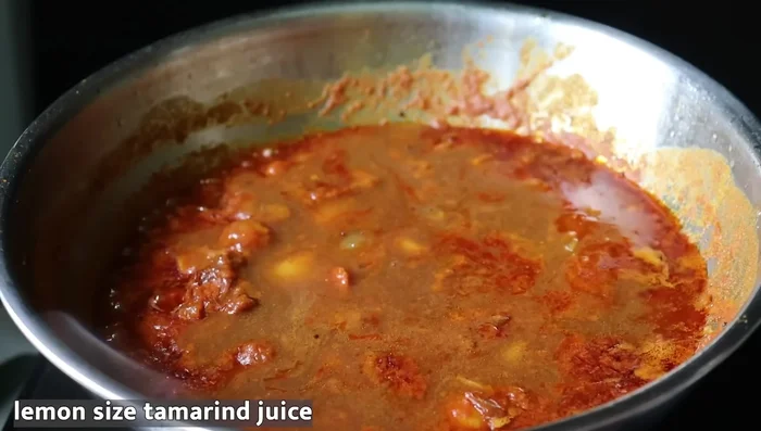 Add tamarind solution (soaked small lemon-sized tamarind, drained well). Mix well and add more salt if needed.