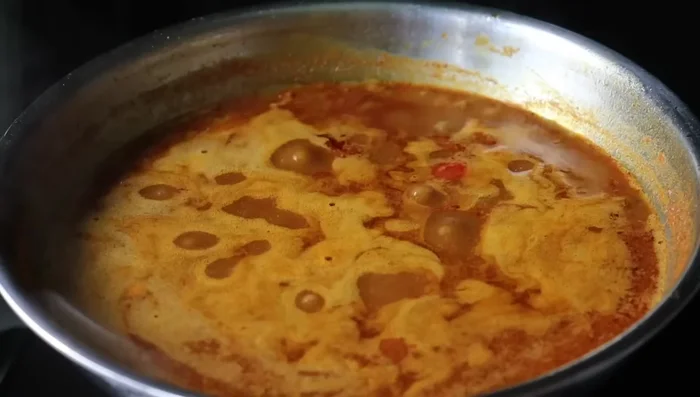 Bring to a boil, then reduce heat and simmer until oil separates.