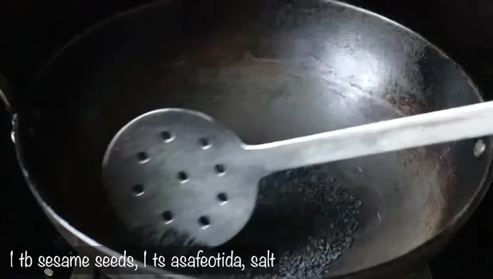 Fry 1 tablespoon of sesame seeds until browned and fragrant.