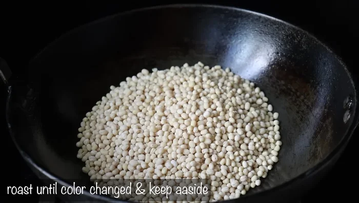 Heat a pan and fry 1 cup of urad dal (whole or broken) on low flame until light golden brown, stirring constantly.