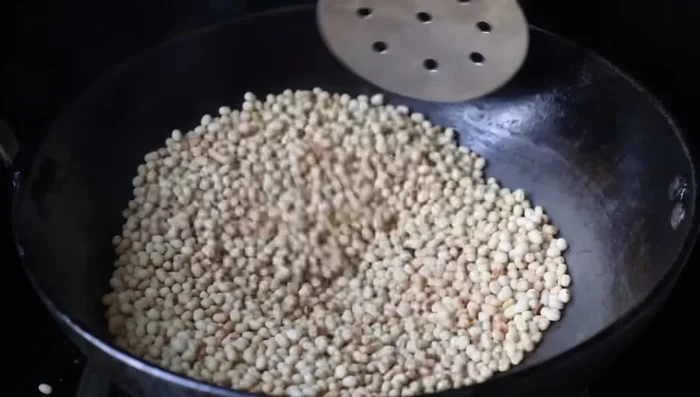 Transfer the fried urad dal to a plate and let it cool.