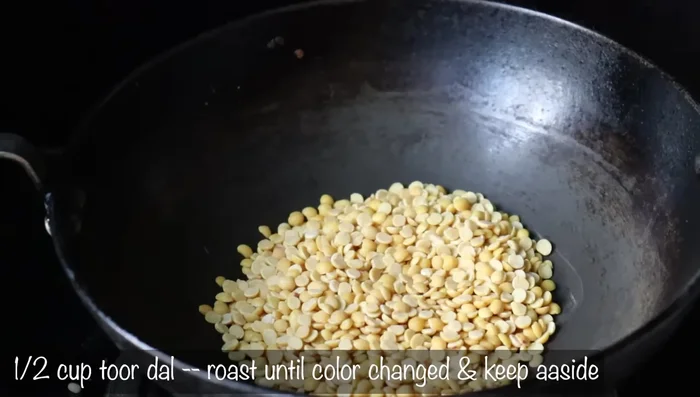 Fry 1/2 cup of black gram in the same pan until it changes color, stirring constantly.