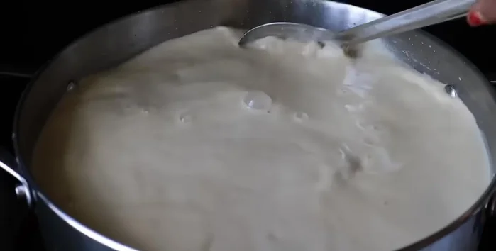 Add cardamom powder, salt, and ghee (in small increments) while continually stirring. The mixture will reach a halva-like consistency.