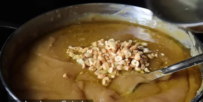 Roast cashew nuts in ghee and add to the mixture.