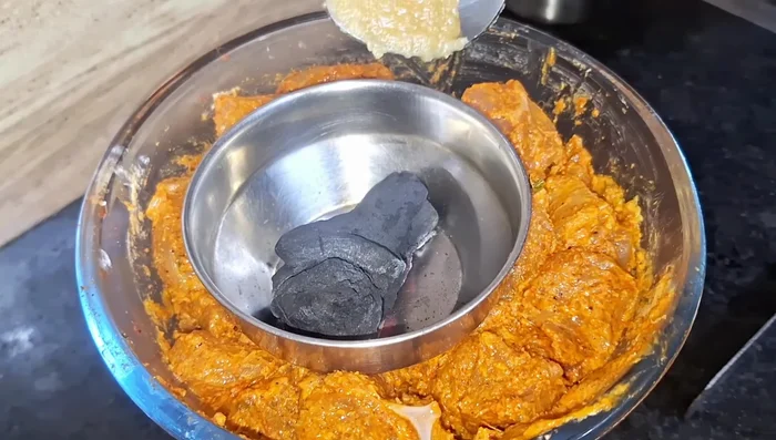 Heat charcoal and add it to a bowl with ghee for a smoky flavor.