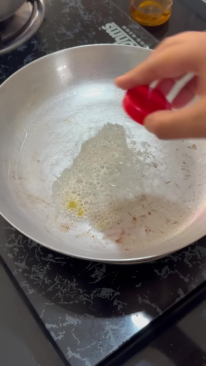 In a pan, heat ghee. Add asafoetida, cumin seeds, dried chilies, ginger, and garlic (finely chopped). Skip ginger if you prefer.