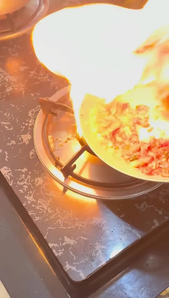Set the pan on fire briefly for a smoky flavor (optional).