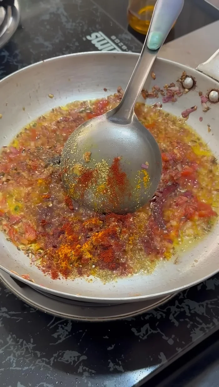 Add turmeric powder, coriander powder, red chili powder, and garam masala. Fry the spices for about a minute.