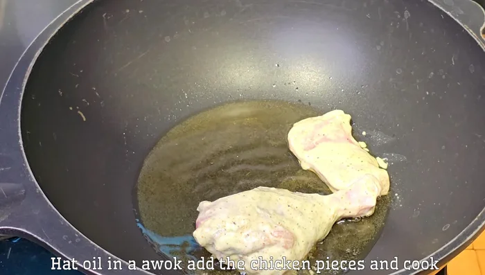 Add the marinated chicken pieces to the pan, spreading them out, and cook for 5 minutes without stirring.