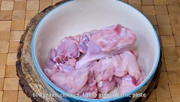Wash and pat dry 600 grams of chicken. You can optionally score the chicken for better cooking.