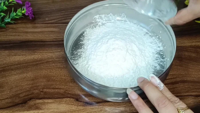 Prepare batter: Mix ½ cup cornflour, ½ cup flour, salt, and water to create a thick slurry.