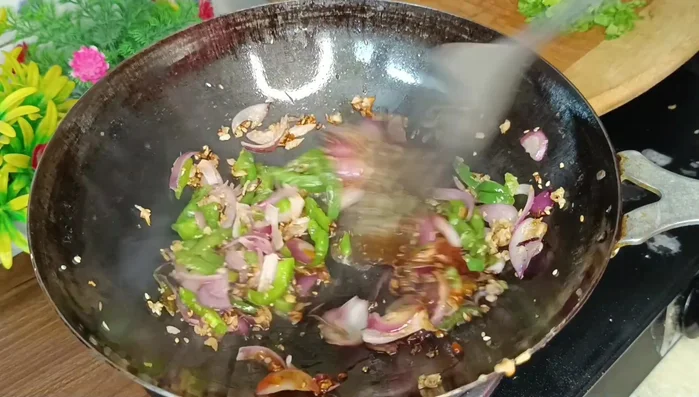 Add Schezwan sauce, soy sauce, vinegar, and tomato ketchup. Mix well.