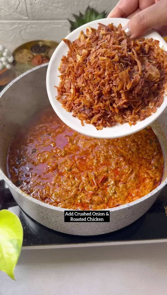Combine chicken and onions: Add crushed onions and roasted chicken to the curd mixture. Cook for 5-10 minutes.