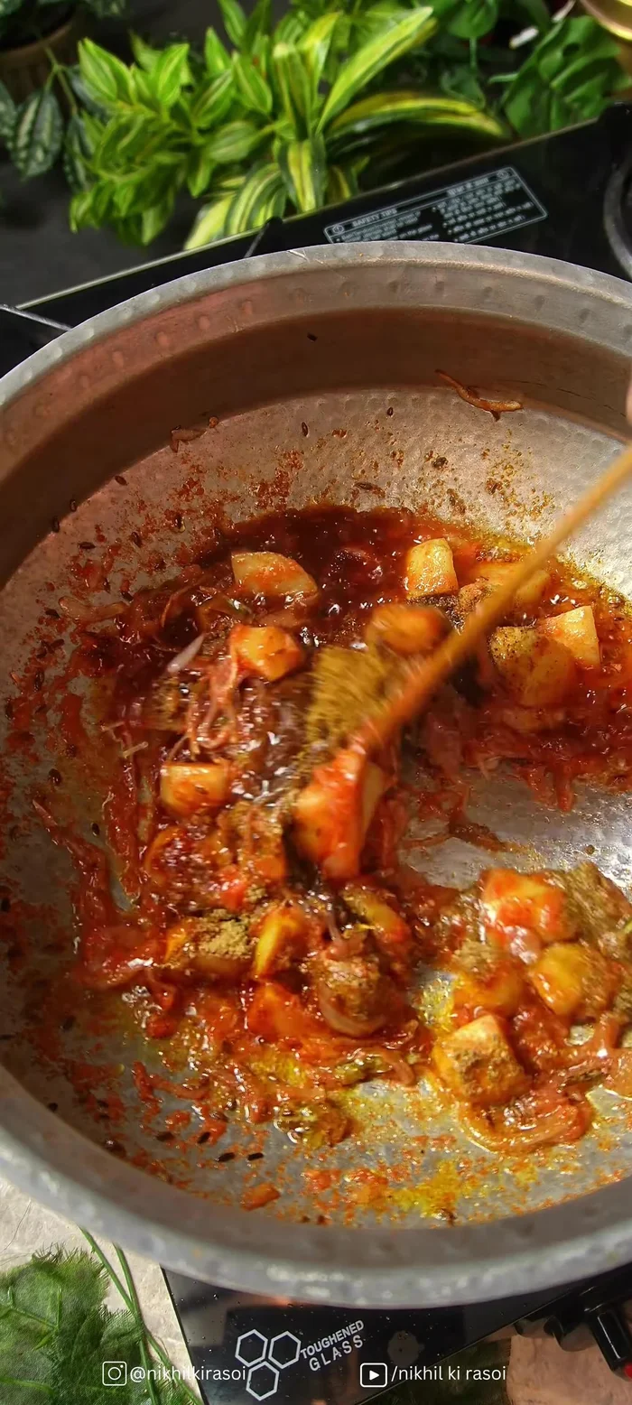 Add fried onions, curd, and kasuri methi; cook.