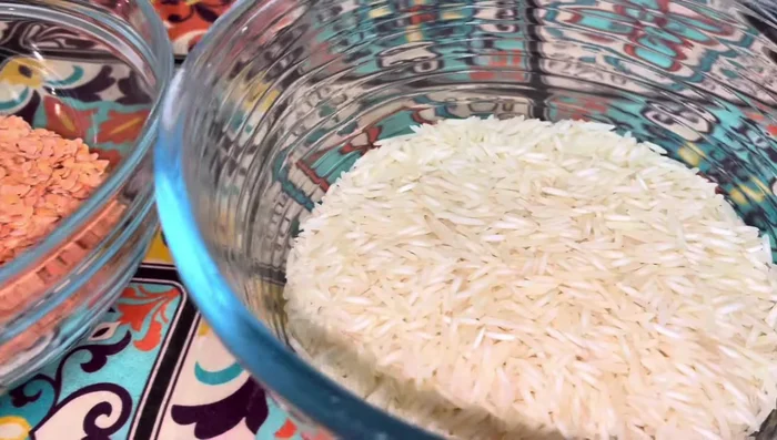 Thoroughly wash and soak the lentils and rice. This step is important to ensure even cooking.
