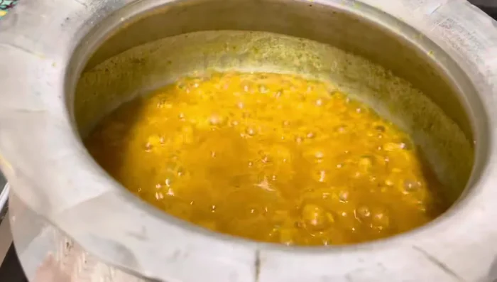 Once the rice is cooked, drain the excess water.