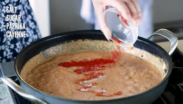 Finish the Pasanda: Return sauce to the skillet. Add sugar, paprika, and cayenne. Bring to a boil. Add tofu and water to adjust consistency. Cover and simmer 10 minutes to thicken the sauce.