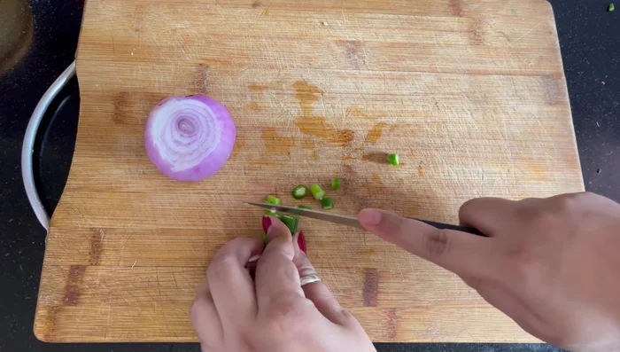 Finely chop one small/medium onion and three green chilies (adjust to your spice preference).